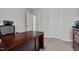 Home office area with a desk and a closet at 810 Mulberry Rd, Spring Hope, NC 27882