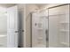 A bathroom with a sliding glass shower door and a built in shower caddy at 813 Canis Minor Rd, Wendell, NC 27591
