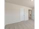 A bright and spacious bedroom features neutral carpeting and a walk-in closet at 813 Canis Minor Rd, Wendell, NC 27591
