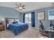 Comfortable bedroom with vaulted ceiling, carpeted floors, ceiling fan, and large window at 900 Ambergate Sta, Apex, NC 27502