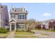 Charming two-story home features dormer windows, gray siding, and a well-manicured front yard with mature landscaping at 900 Ambergate Sta, Apex, NC 27502