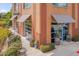Commercial building exterior with brick facade, awnings, decorative barrels, and outdoor seating at 900 Ambergate Sta, Apex, NC 27502
