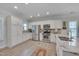 Bright, modern kitchen features stainless steel appliances, granite countertops, and white cabinets at 900 Ambergate Sta, Apex, NC 27502