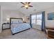 Inviting main bedroom with vaulted ceiling, ceiling fan, large window, and carpeted floors at 900 Ambergate Sta, Apex, NC 27502