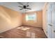 This bedroom has hardwood floors, a ceiling fan and natural light from the window at 926 Allister Rd, Durham, NC 27703
