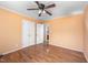Bedroom features hardwood floors, a ceiling fan, and access to an ensuite bathroom at 926 Allister Rd, Durham, NC 27703
