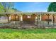 View of the covered patio with brick flooring, wooden beams, and a glimpse of the backyard at 926 Allister Rd, Durham, NC 27703