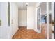 Foyer showcasing wood pattern flooring and an open view into the kitchen and adjoining living spaces at 926 Allister Rd, Durham, NC 27703
