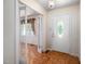 Foyer featuring wood pattern flooring and an open view into the bright and airy living spaces at 926 Allister Rd, Durham, NC 27703
