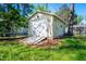 Exterior shot of the detached garage with roll up door on a sunny day at 926 Allister Rd, Durham, NC 27703