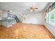 Open-concept living room featuring beautiful wood floors and ample natural light at 926 Allister Rd, Durham, NC 27703