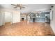 Spacious living area with wood pattern flooring, fireplace, and kitchen with modern appliances at 926 Allister Rd, Durham, NC 27703