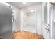 Mud room leading to door, closet, and stainless steel refrigerator at 926 Allister Rd, Durham, NC 27703