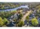Aerial view of a neighborhood surrounding a body of water at 944 Alden Bridge Dr, Cary, NC 27519