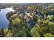 Aerial shot showcases a community with waterfront views and mature trees at 944 Alden Bridge Dr, Cary, NC 27519