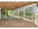 Open covered patio with brick flooring and scenic backyard views at 944 Alden Bridge Dr, Cary, NC 27519