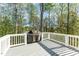 Enjoy outdoor cooking on this spacious deck overlooking a wooded area and waterfront at 944 Alden Bridge Dr, Cary, NC 27519