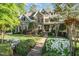 Inviting home with manicured front yard, brick walkway, and flowering shrubs at 944 Alden Bridge Dr, Cary, NC 27519