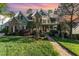 Beautiful home with stone and siding, lush lawn, manicured landscaping, and a brick walkway at 944 Alden Bridge Dr, Cary, NC 27519