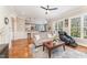 Open living space with hardwood floors and view of kitchen at 944 Alden Bridge Dr, Cary, NC 27519