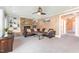Comfortable living room with fireplace, built-in shelves and cozy seating area at 944 Alden Bridge Dr, Cary, NC 27519