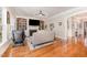 Cozy living room with built-in bookshelves and a fireplace at 944 Alden Bridge Dr, Cary, NC 27519