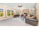 Spacious living room with stone fireplace, large windows and comfortable seating at 944 Alden Bridge Dr, Cary, NC 27519