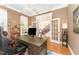 Elegant office with coffered ceiling, french doors, and hardwood floors at 944 Alden Bridge Dr, Cary, NC 27519
