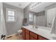 Bathroom features wood cabinets, a white sink, and a shower with a clear glass door at 95 Torrington Ave, Franklinton, NC 27525
