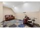 Finished basement space with brown leather couch and a full drum set at 95 Torrington Ave, Franklinton, NC 27525