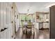 Cozy dining area with natural light, a modern table, and a view of the backyard at 95 Torrington Ave, Franklinton, NC 27525