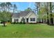 Charming one-story home with manicured lawn, tasteful landscaping, and inviting curb appeal at 95 Torrington Ave, Franklinton, NC 27525