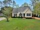 Charming one-story home with manicured lawn, tasteful landscaping, and inviting curb appeal at 95 Torrington Ave, Franklinton, NC 27525