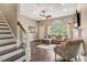 Spacious living room with fireplace and large windows, showcasing a comfortable seating arrangement at 95 Torrington Ave, Franklinton, NC 27525