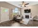 Bright living room featuring a fireplace, plush seating, and ample natural light at 95 Torrington Ave, Franklinton, NC 27525