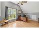 Bright office space features a desk with a view, hardwood floors, and ample natural light at 95 Torrington Ave, Franklinton, NC 27525