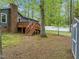 Backyard with deck, wooden stairs, and storage shed at 1015 Castalia Dr, Cary, NC 27513