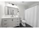 Modern bathroom with a sleek vanity, large mirror, and shower-tub combination at 1015 Castalia Dr, Cary, NC 27513