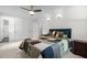Cozy bedroom with a bed, closet, and well-lit ambiance at 1015 Castalia Dr, Cary, NC 27513