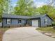 Charming home with a well-maintained yard, garage, and concrete driveway at 1015 Castalia Dr, Cary, NC 27513