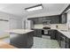 Stylish kitchen features stainless appliances, custom cabinets and unique tile floors at 1015 Castalia Dr, Cary, NC 27513