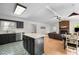 Bright open concept kitchen features stainless appliances and opens to living area at 1015 Castalia Dr, Cary, NC 27513