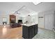 Spacious living area with a brick fireplace and seamless flow to adjacent rooms at 1015 Castalia Dr, Cary, NC 27513