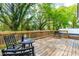 Spacious back deck is an ideal space for outdoor dining and relaxation, complete with a grill at 1023 Kent St, Durham, NC 27707