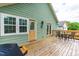Well-maintained back deck with dining set and grill, providing an excellent outdoor entertainment area at 1023 Kent St, Durham, NC 27707