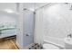 Bathroom showcases white marble tile in the shower with a toilet and connecting bedroom at 1023 Kent St, Durham, NC 27707