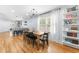 Bright dining room with hardwood floors, modern chandelier, and view of the kitchen at 1023 Kent St, Durham, NC 27707