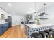 Open kitchen with an island, stylish backsplash, and stainless steel appliances at 1023 Kent St, Durham, NC 27707