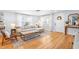 Bright living room with hardwood floors, modern furnishings, and large windows offering ample natural light at 1023 Kent St, Durham, NC 27707