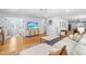 Bright, open living room with hardwood floors, a sectional sofa, and seamless flow into other living spaces at 1023 Kent St, Durham, NC 27707